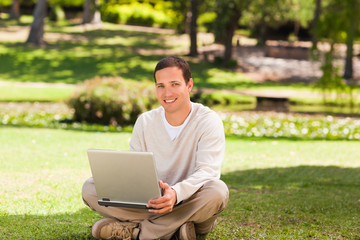 Man working on his laptop in the park