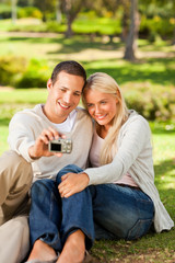 Fototapeta premium Young couple taking a photo of themselves