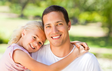 Obraz premium Father with her daughter in the park