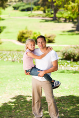 Fototapeta premium Father with her daughter in the park