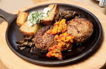 Meat dish - shnitzels, fried potato and garnish