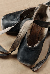 A pair of well worn black ballet shoes - 30637726