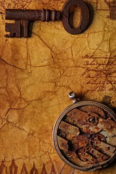The old key with a gears on the old textured paprer
