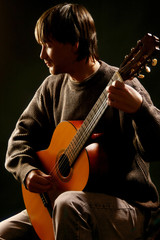 Classical guitarist on the guitar concert.