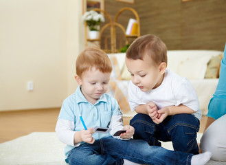 two happy smiling and laughing boys at home