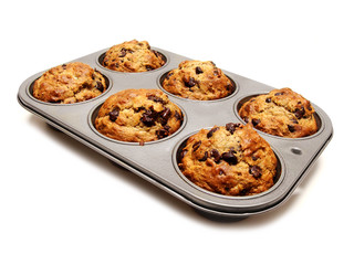 A tray of freshly baked muffins on white