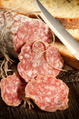 italian salami with slice bread and knife