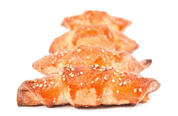 Home made bread rolls with sesame seeds isolated on white backgr