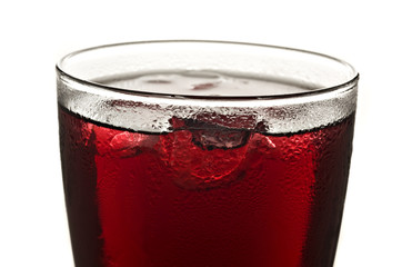 Close up of  a glass of red fruit juice