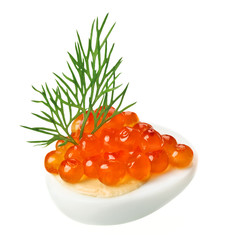 Red caviar canape with quail egg and dill twig