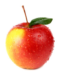 apple with a green leaf is in drops