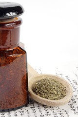 old pharmacy bottle and dose of herbs