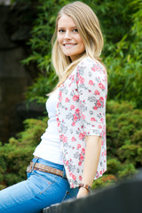 portrait of funny beautiful woman at the park