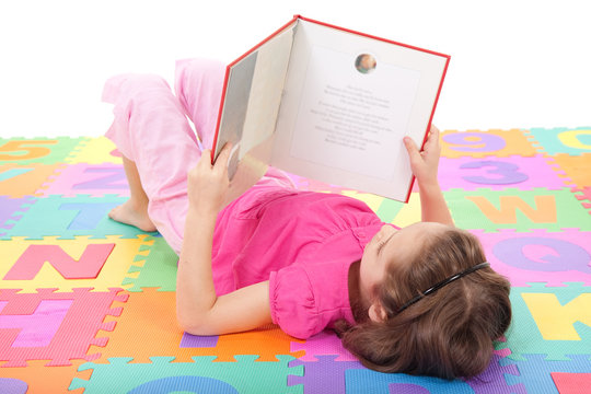Girl child reading book