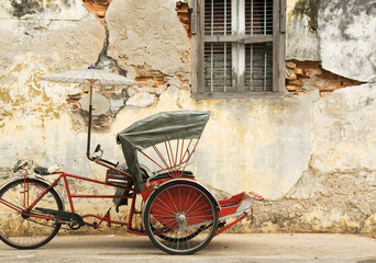 Fototapeta na wymiar Old Red Trishaw, George Town, Penang