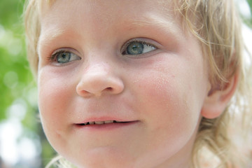 smiling child portrait on natural background