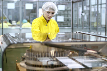 Female Worker At Pharmaceutical Factory