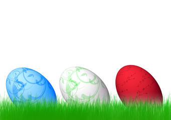 three easter eggs an green grass