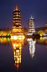 Tuinposter Double towers in guilin nightscape © cityanimal