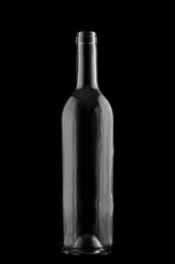 Wine bottle silhouette against black