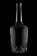 Cognac bottle silhouette against black