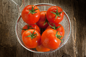 tomatoes on wood background