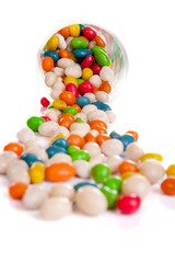 round candies spill out of cups