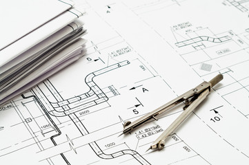 Project drawings and measurement tool on paper