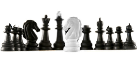 chess isolated. one white knight in front of black chess