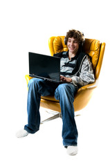 teenage boy working on a laptop