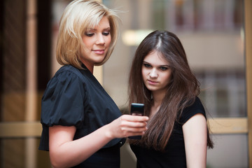 Young women looking at mobile phone