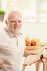 Portrait of senior man at breakfast