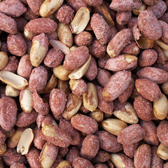 Roasted and salted groundnuts closeup, natural background