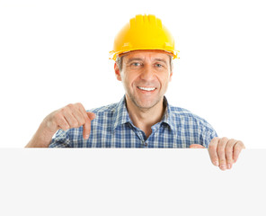Confident worker presenting empty board