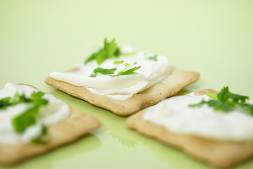 Thin crackers with cream cheese