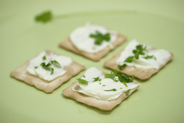 Thin crackers with cream cheese