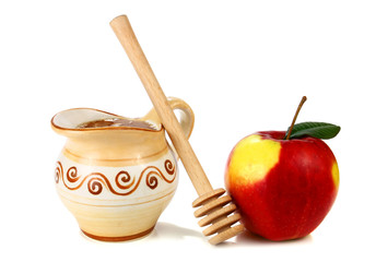 honey in a jug and apple