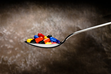 One spoon of medication, pills