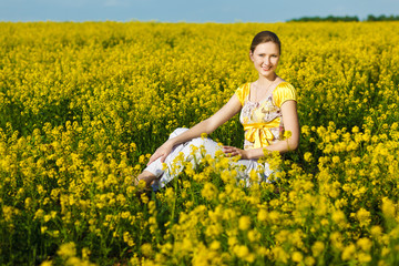 Fototapeta premium happy woman on yellow field