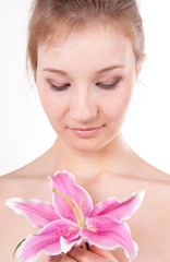 close-up of beautiful woman with lily flower