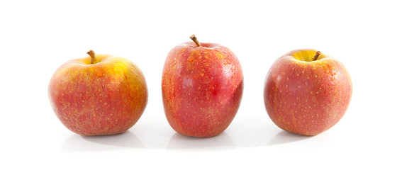 Fototapeta na wymiar three red apples over white background