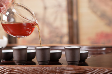 Teapot, cups and a selection of red teas