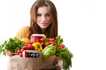 woman holding a bag full of healthy food. shopping .