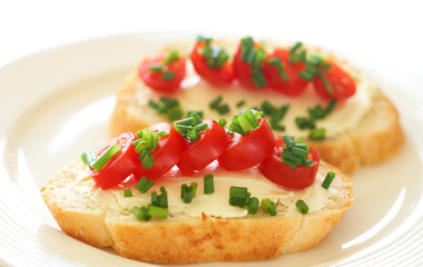 Fototapeta na wymiar Tasty sandwich with cream cheese and tomatoes
