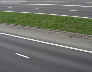 multiple highway with grass border in between