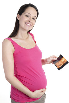 Pregnant Woman Holding 4d Scan Of Her Unborn Baby