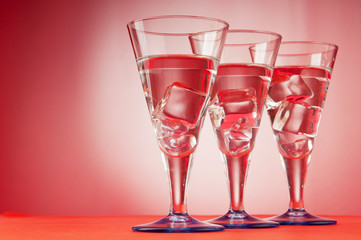 Water in the glass against gradient background