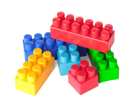 Toy color bricks on white background