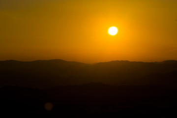 Fototapeta na wymiar Sunset over hills