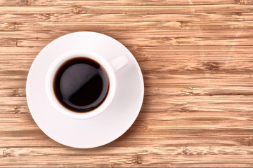 Coffee cup on wooden surface